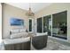 A comfortable outdoor living space with stylish seating and views of a manicured yard at 942 Jack Nicklaus Ct, Kissimmee, FL 34747