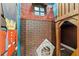 Imaginative playroom with brick wall and toy soldier decor at 942 Jack Nicklaus Ct, Kissimmee, FL 34747