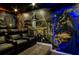 Custom home theater features Batman-themed artwork, reclining seats, and immersive design at 942 Jack Nicklaus Ct, Kissimmee, FL 34747