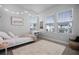 Bedroom with bright string lights and three windows at 1118 Eagles Pass Way, Winter Garden, FL 34787