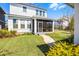 Inviting home exterior with a well-manicured lawn and a charming screened porch at 1118 Eagles Pass Way, Winter Garden, FL 34787