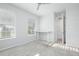 Bright, carpeted bedroom with two windows, a ceiling fan, and a small desk at 115 E Concord St # 3, Orlando, FL 32801