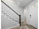 Welcoming entryway featuring stairs with wood and white accents and wood-look floors at 115 E Concord St # 3, Orlando, FL 32801