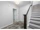 Inviting entryway with staircase, dark wood accents and decorative rug at 115 E Concord St # 3, Orlando, FL 32801