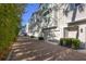 Row of townhomes with brick driveway and well-maintained landscaping at 115 E Concord St # 3, Orlando, FL 32801