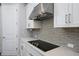 Stylish kitchen featuring sleek countertops, stainless steel range hood, and modern backsplash at 115 E Concord St # 3, Orlando, FL 32801