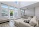 Bright living room with large windows, high ceilings, and a comfortable sectional sofa at 115 E Concord St # 3, Orlando, FL 32801