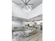 Spacious open-concept living area with vaulted ceiling, modern decor and kitchen view at 115 E Concord St # 3, Orlando, FL 32801