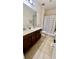 Well-appointed bathroom featuring dual sinks, a large mirror, and a shower-tub combo, offering convenience and style at 11725 Sprawling Oak Dr, Windermere, FL 34786