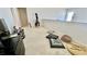 Open loft space with neutral carpeting, providing a flexible area for a home office, playroom, or additional living space at 11725 Sprawling Oak Dr, Windermere, FL 34786