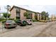 Spacious parking lot and exterior view of a multi-story residential building with screened-in balconies at 120 Blue Point Way # 360, Altamonte Springs, FL 32701