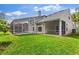 Spacious backyard featuring a screened-in pool and patio area, perfect for outdoor entertaining at 13325 Falcon Pointe Dr, Orlando, FL 32837