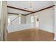 Bright dining room with hardwood floors, decorative chandelier, and a large wall mirror at 13325 Falcon Pointe Dr, Orlando, FL 32837