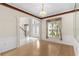 Formal dining room with a chandelier, decorative wallpaper and arched doorway at 13325 Falcon Pointe Dr, Orlando, FL 32837