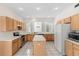 Spacious kitchen with white countertops, tile floor, and stainless steel appliances at 13325 Falcon Pointe Dr, Orlando, FL 32837