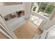 Aerial view of living room with fireplace, wood floors, and view of kitchen at 13325 Falcon Pointe Dr, Orlando, FL 32837