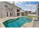 Relaxing screened-in pool and spa area with ample deck space, perfect for outdoor entertaining at 13325 Falcon Pointe Dr, Orlando, FL 32837