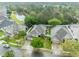 An aerial view showing the proximity of home with a screened pool to a picturesque pond at 13812 Magnolia Glen Cir, Orlando, FL 32828