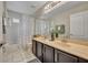 Bathroom features a double sink vanity and shower-tub combo at 13812 Magnolia Glen Cir, Orlando, FL 32828