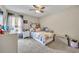 Cozy bedroom with a ceiling fan and a large window at 13812 Magnolia Glen Cir, Orlando, FL 32828