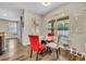 Cozy breakfast nook with glass table and large window overlooking the pool at 13812 Magnolia Glen Cir, Orlando, FL 32828