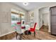 Bright breakfast nook with view of the pool area through large window at 13812 Magnolia Glen Cir, Orlando, FL 32828