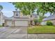 Charming two-story home featuring a well-manicured lawn, stone accents, and a spacious three-car garage at 13812 Magnolia Glen Cir, Orlando, FL 32828