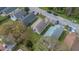 Aerial perspective showcasing the home's position within a neighborhood with mature trees and landscaping at 1525 Rivers Edge Dr, Orlando, FL 32825