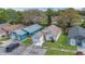 Aerial shot showcasing the home's curb appeal, driveway, and proximity to neighboring properties at 1525 Rivers Edge Dr, Orlando, FL 32825