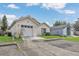 Single-story home featuring an attached garage and a well-maintained lawn under a blue sky at 1525 Rivers Edge Dr, Orlando, FL 32825