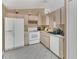 Well-lit kitchen featuring standard appliances and tile flooring at 1525 Rivers Edge Dr, Orlando, FL 32825