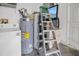 The utility room offers a washing machine, water heater, and ladders at 1525 Rivers Edge Dr, Orlando, FL 32825