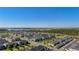 Wide aerial view of a residential neighborhood with a lake, greenery, and well-maintained homes at 15926 Marina Bay Dr, Winter Garden, FL 34787