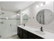 Nicely decorated bathroom featuring dual sinks and a glass shower at 15926 Marina Bay Dr, Winter Garden, FL 34787