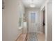 Bright foyer with neutral tones, tiled floor, and a front door with decorative window at 15926 Marina Bay Dr, Winter Garden, FL 34787