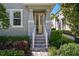 A welcoming front porch featuring brick stairs and a charming, open doorway at 15926 Marina Bay Dr, Winter Garden, FL 34787