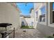 Cozy outdoor patio with brick pavers, string lights, and a small seating area with modern chairs at 15926 Marina Bay Dr, Winter Garden, FL 34787