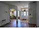 Inviting foyer with high ceilings, hardwood floors, decorative archways, and an ornate glass front door at 1924 Eloise Cove Dr, Winter Haven, FL 33884