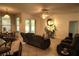 Comfortable living room featuring a ceiling fan, tile flooring, and sliding glass doors to the outdoor area at 1924 Eloise Cove Dr, Winter Haven, FL 33884