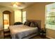 Comfortable bedroom with ceiling fan, and natural light from the windows at 1924 Eloise Cove Dr, Winter Haven, FL 33884