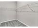 Spacious walk-in closet features sturdy wire shelving for optimal organization and storage at 2313 Mystic Maze Ln, Clermont, FL 34715