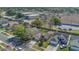 Aerial view of neighborhood and house on a sunny day at 2421 Hybrid Dr, Kissimmee, FL 34758