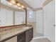 Granite vanity with shower stall in well lit and clean bathroom at 2421 Hybrid Dr, Kissimmee, FL 34758