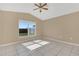 Inviting bedroom with tile floors and a large window offering natural light at 2421 Hybrid Dr, Kissimmee, FL 34758