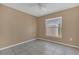 Cozy bedroom featuring tile floors, a ceiling fan, and a window providing ample natural light at 2421 Hybrid Dr, Kissimmee, FL 34758