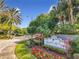 Welcoming entrance sign amidst colorful flowers and lush greenery, establishing community's identity at 2580 Grassy Point Dr # 100, Lake Mary, FL 32746