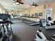 Community gym featuring treadmills, stationary bicycles, ceiling fans and mirrored walls at 2580 Grassy Point Dr # 100, Lake Mary, FL 32746