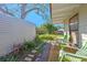 Exterior view of backyard featuring a storage shed, seating, landscaping, and stone walkway at 3006 Northwood Blvd, Winter Park, FL 32789