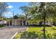 Charming single story home featuring a gravel driveway, covered entryway, and well maintained lawn at 3006 Northwood Blvd, Winter Park, FL 32789