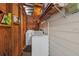 Functional laundry room with washer and dryer hookups and storage shelves at 3006 Northwood Blvd, Winter Park, FL 32789